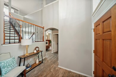 Gorgeous wood tile flooring in this two-story entry way.