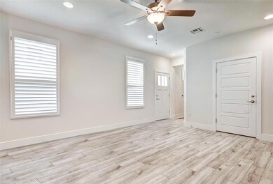 Spare room with light wood-style flooring, a ceil