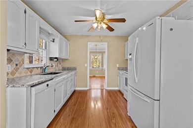 Kitchen with light wood finished floors, decorativ