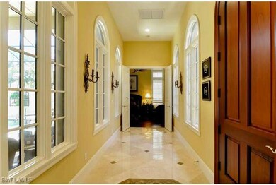 Impressive foyer with custom marble flooring and a