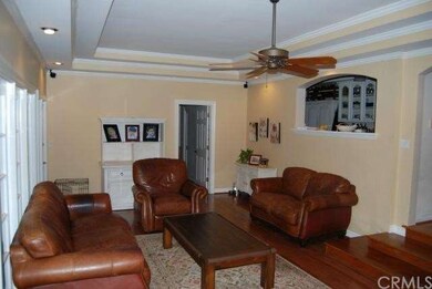 Family room has wood flooring, recessed lighting, 