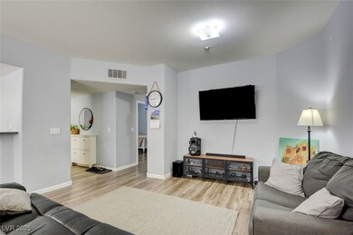 Living room with wood-type flooring