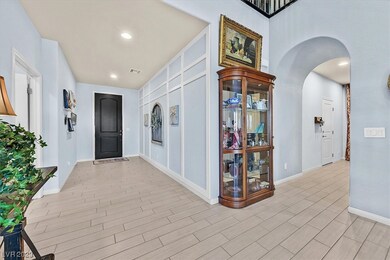 Wonderful foyer! Tile wood look flooring.