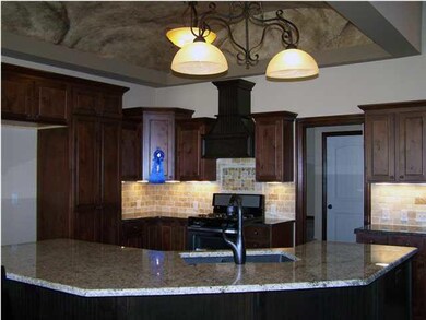 Kitchen with faux painted barrel ceiling, island, 
