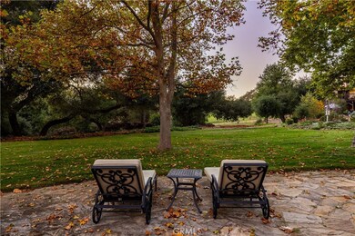 Mature trees enhance the home’s outdoor charm.