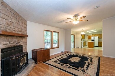 Kitchen opens to family room w/ wood stove.