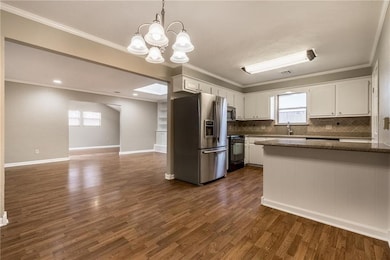 Kitchen featuring stainless steel appliances, whit