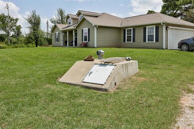 Entry to storm shelter with a lawn