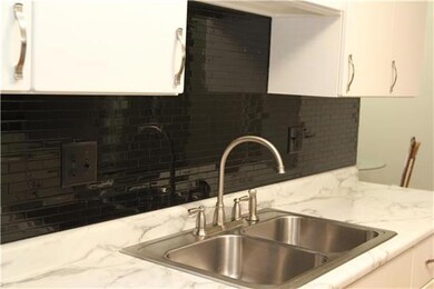 New back splash, there is a lighting feature above the sink!