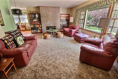 Formal living room has original hardwoods under th