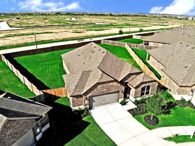 What a fantastic home situated on a Huge Lot with over-sized backyard with no rear neighbors! Beautiful brick and Stone Elevation!  Look at Doc's and VT for more information.  We take care of the Front Yard, so this way all homes are stunning and beautiful front yards.  You take care of your private yard!  It's all about you now!  That Organic Garden you always wanted, space for your furry friends and more.  All Gated!