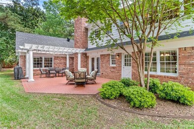 Awesome brick patio with pergola just off the fami