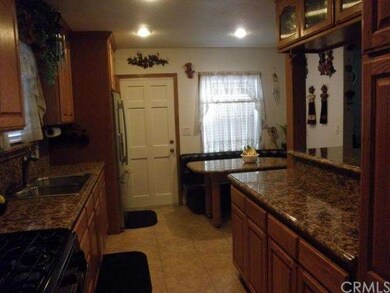 Granite counter tops, Ceramic tile floors in Kitch