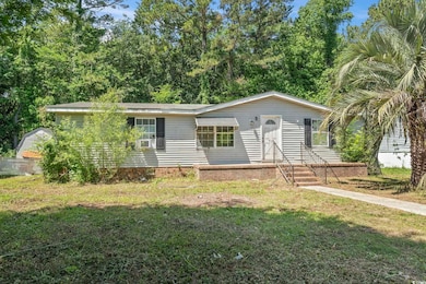 Single story home with a front lawn