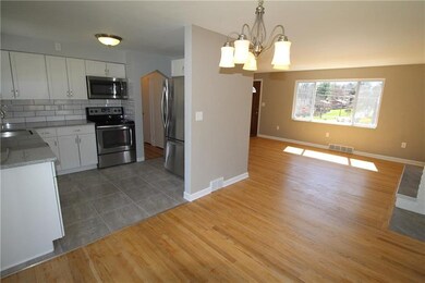 Living room, dining room, and kitchen all open to 