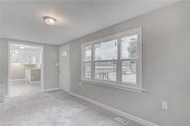 As you enter the home, living room  with new energy efficient windows will welcome you to home.