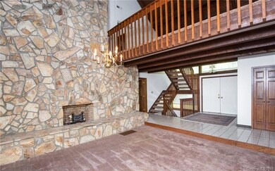 Great room with vaulted ceilings, wood beams and g