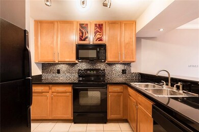 Updated kitchen counters, backsplash and lighting