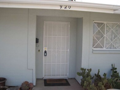 Metal security door at front entrance