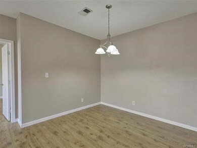 Dining area...freshly painted with chandelier
