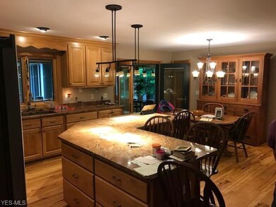 The oversize granite island with stacks of Custom 