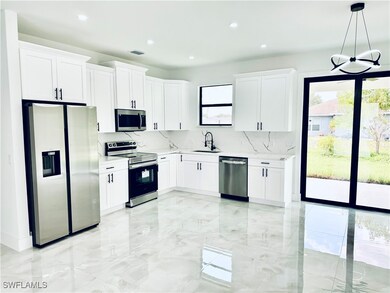 Kitchen featuring appliances with stainless steel