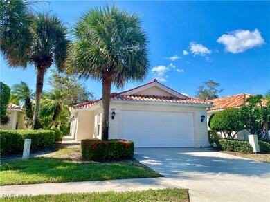 Mediterranean / spanish-style house featuring a ga