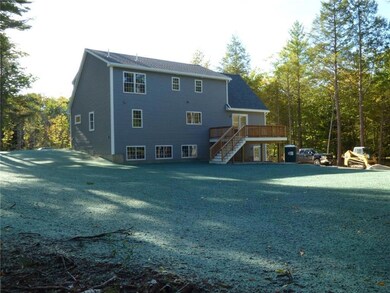 View of the back of the home and...