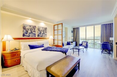 Bedroom featuring crown molding, light wood-style
