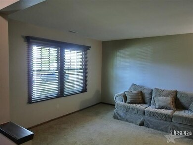 Front living room with crown molding & custom blin