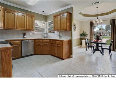 Open Dining with Recessed Ceiling and Bronze Chand