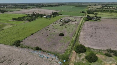 Aerial view of property's location with rural landscape and farmland