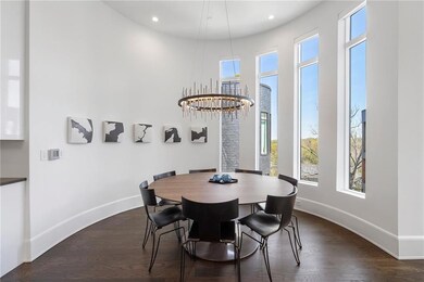 Dining room featuring baseboards, dark wood-style 
