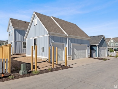 Garage with concrete driveway