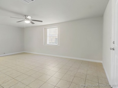 featuring ceiling fan, light tile patterned floori