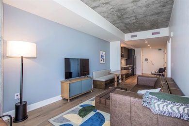 Living area with light wood finished floors and b