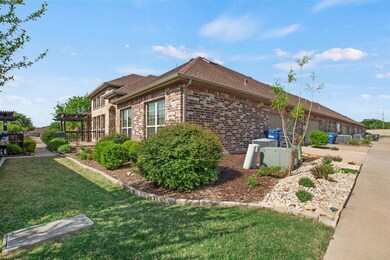 View of side of property featuring a pergola, a ya