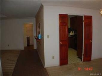 Stepping forward from foyer, view to kitchen door,