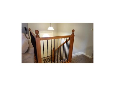 Wrought Iron Spindles and Tiled Entryway