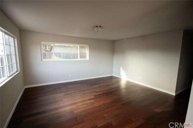 Spacious family room with new bamboo floors, paint