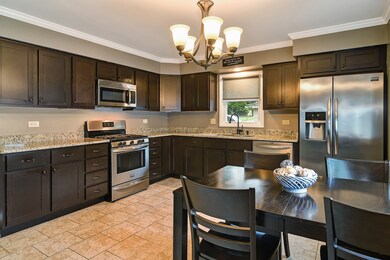This kitchen offers sturdy maple and espresso stai