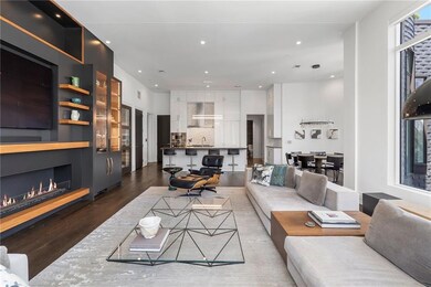 Living area featuring a fireplace, wood finished f