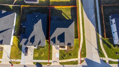 This home sits on a large corner lot with ample yard space in front and the back, lush landscaping and a well-maintained yard.