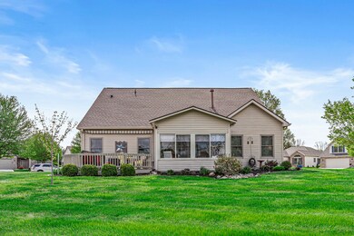 The rear elevation of this home with beautiful landscaping.