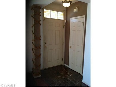Foyer - Nice details, such as transom and tiled fl