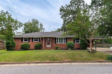 Ranch-style house featuring brick siding, concrete