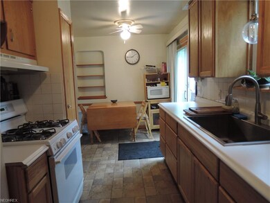 Eat in kitchen with glass sliding door to deck & p