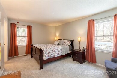 Primary bedroom with new carpet and neutral color 