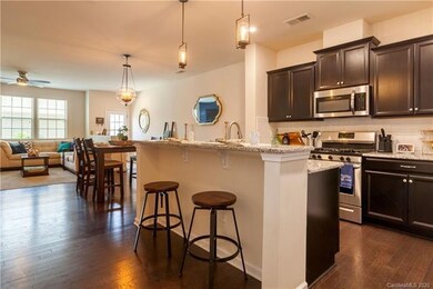 Laminate wood floors glean throughout the entire d