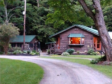 To the left of the house is the mancave and an out
